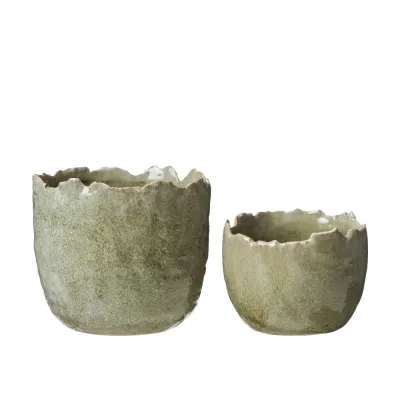 Set of two green melange pots Liya shaped like eggshells from Wikholm Form.