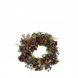 Autumn and winter wreath with hydrangea in dark red and green from Wikholm Form.