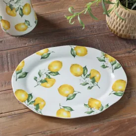 Oval tallrik eller mindre serveringsfat Maison Citron i porslin med gröna blad och gula citroner på cremevit botten från Chic An