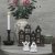 Two small white ceramic decorative figures shaped like ghosts—the Spöke Lilla Boo model from Wikholm Form—beautifully styled on