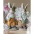 Mr. and Mrs. Rabbit on table with flowers in the background from A Lot Decoration