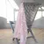 Kitchen towel Sonia in pink from Fondaco hanging on a chair.