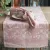 The runner Sonia in pink from Fondaco on a table.