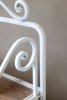 Close-up view of an antique-style shelf with wooden shelves, from Chic Antique.