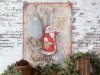 Large, patinated vintage iron sign featuring an embossed Santa Claus holding a lantern beside fir boughs and pine cones.