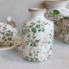 Chic Antique Grasse bottle-shaped ceramic vase featuring a hand-painted green branch motif and a glossy, crackle-glaze finish.