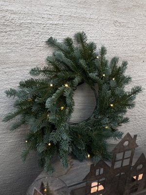 Pre-lit Christmas wreath 1005133 from A Lot Decoration with realistic faux pine branches and warm white LED lights