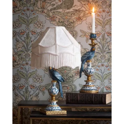 Blue lamp base with parrot 43 cm with white shade on table with floral wallpaper in the background from A Lot Decoration