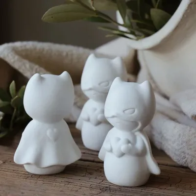 superhjälte-token-lyckofigur-vit-majas-cottage