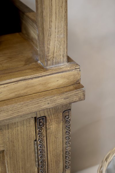 Close-up of the divider between the upper and lower sections of the Marseille bookcase in a natural finish from Chic Antique.