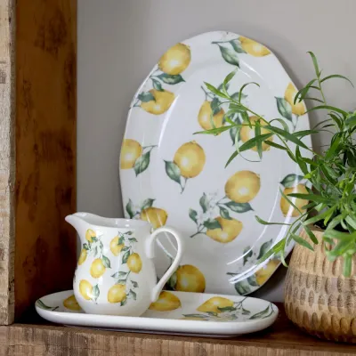 Maison lemon milk jug from Chic Antique on a wooden shelf.