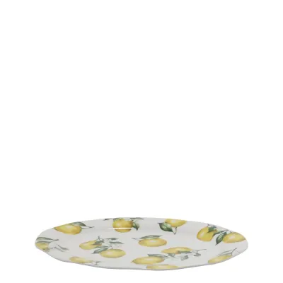 Mindre ovalt cremevitt serveringsfat Maison Citron i porslin med mönster av gula citroner, längd 30 cm.
