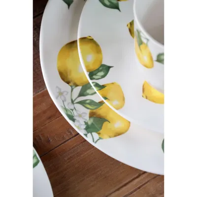 Närbild på middagstallriken Maison citron med dolgula citroner från Chic Antique.