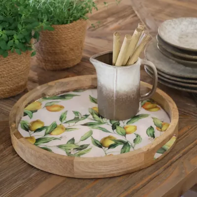 Tray of Tours with lemons on a table with a jug with cutlery