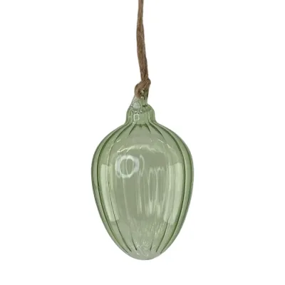 Ljusgrönt glasägg med virvlande struktur från Miljögården