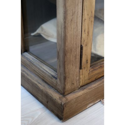 Detail image of the bottom piece for the Marseille display cabinet in natural wood.